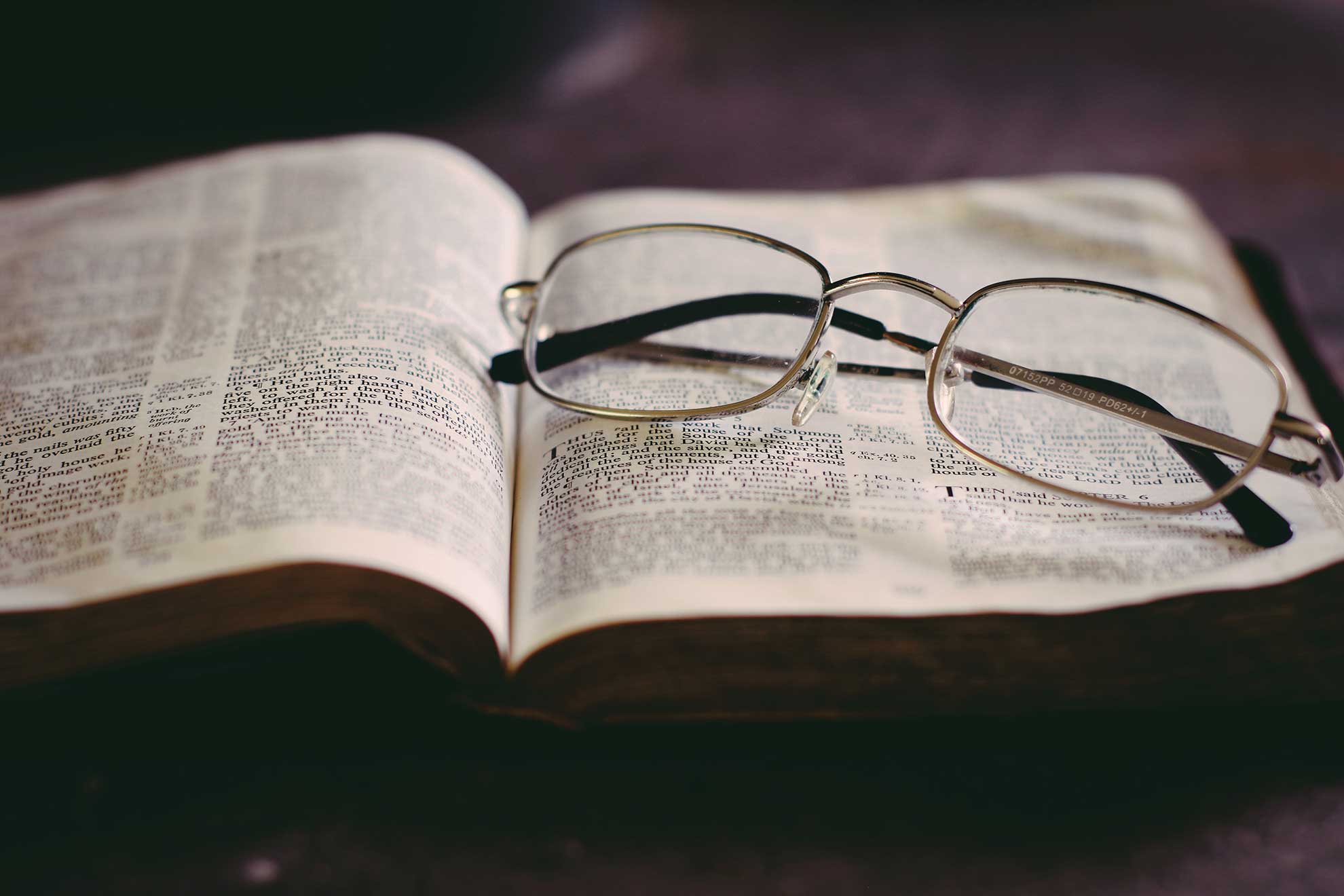 Glasses Resting on a Bible